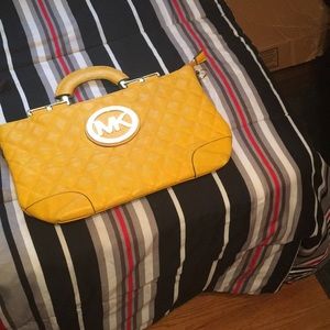 Name brand purses from coach,MK and leather